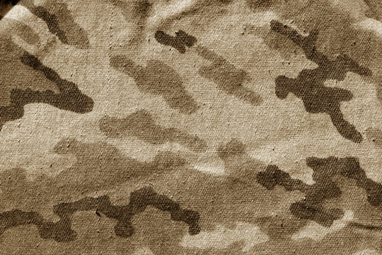 Dirty camouflage cloth in brown tone.