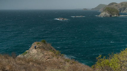 coast of japan sea with girl on a clif