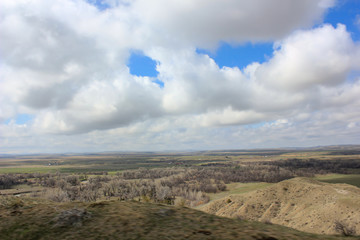 blue sky and clouds over prarie