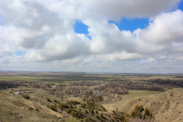 blue sky and clouds over prarie