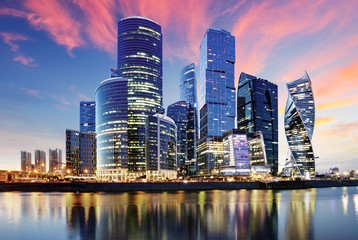 Skyscrapers of Moscow City business center and Moscow river in Moscow at night, Russia....