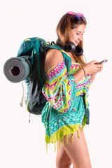 Traveling girl with backpack and phone