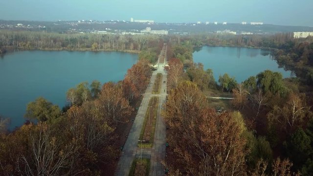 Aerial footage over Echo Park Lake, Kishinev, Moldova republic of. View of lake and smille bridge.