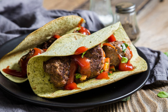 Tacos with meatballs and sauce
