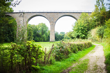 Old arch bridge for peoples and cars