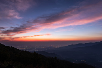 twilight of mountain with city light at dawn, taken from viewpoint of Mon Long, Mae Rim Chiang Mai, Thailand