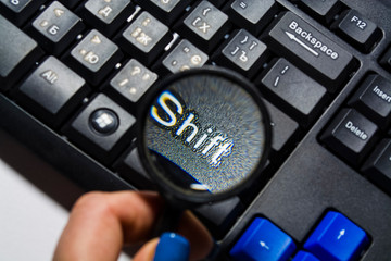 The black computer keyboard with colored buttons. Buttons close up. Modern equipment. Background...