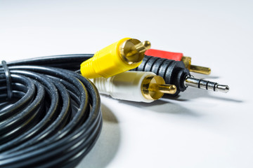 Hank of multi-colored plugs. Adapter. Tulips adapters for audiodevices. On a white background. The...