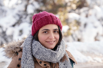 Portrait of a young beautiful woman in winter.