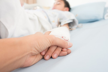 Little boy get sick from influenza need to be admitted to hospital with saline intravenous (iv) ...