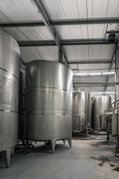 Modern winery interior with aluminium tanks with controlled cooling system