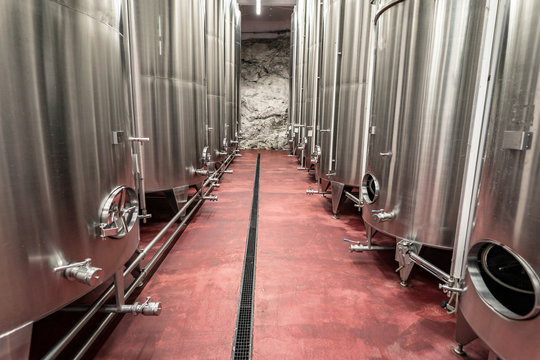 Aluminium tanks for making wine in a modern winery