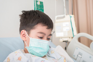 Little boy get sick from influenza need to be admitted to hospital with saline intravenous (iv) ...