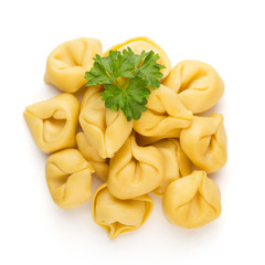 Raw homemade pasta,tortellini with herbs.
