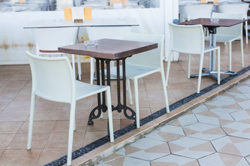 Cafe, coffee shop, tavern and restaurant concept - Empty tables in between dining hours in Europe town.