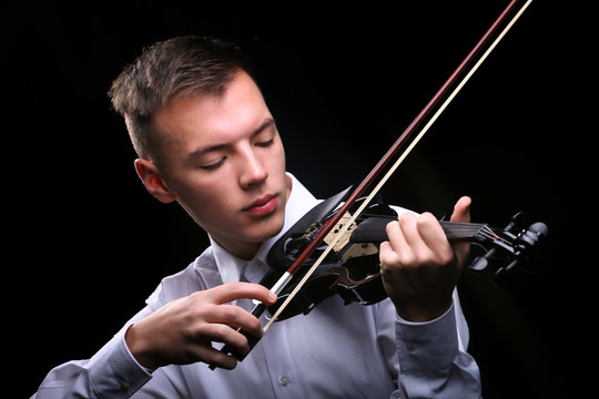 Young men playing the violin