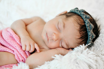 the child's face with a headband in the form of a crown