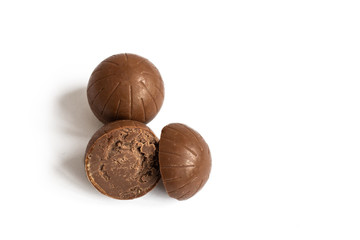 Chocolate candy isolated on white background. Chocolate truffle sweets closeup.
