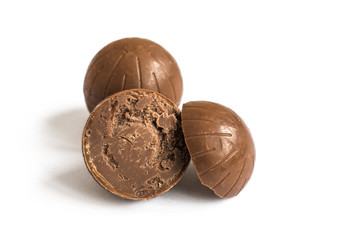 Chocolate candy isolated on white background. Chocolate truffle sweets closeup.