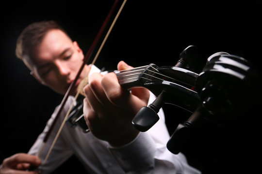 Young men playing the violin