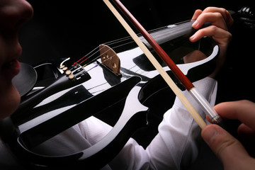 Young men playing the violin