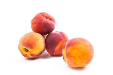 Group of ripe peach fruit isolated on white background.