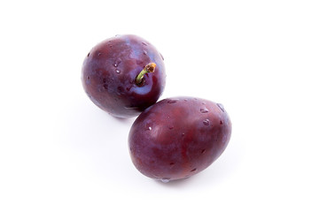 Group of ripe plums isolated on a white background..