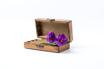Wooden vintage casket, Lilac spring flowers on a white background