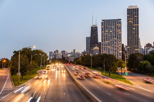Chicago, traffic on highway with city skyscrapers on background