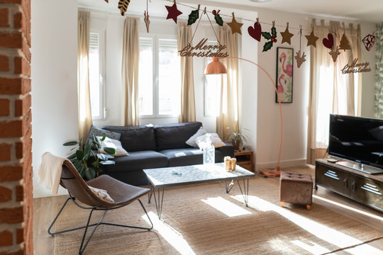 Light modern room decorated for Christmas wreath