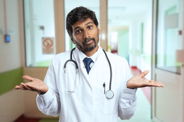 Doctor making clueless expression and gesture.