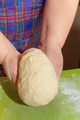 Knead the dough with your hands on the table