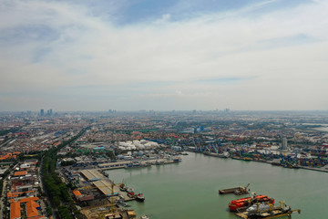Fototapeta premium aerial view cargo and passenger seaport with ships and crane Tanjung Perak, surabaya, indonesia. docks for the repair and parking of ships, cargo port and container terminal. ship in industrial port
