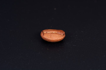 coffee beans on black background consistent with