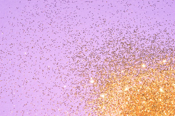 Fototapeta premium Gold glitter on purple background in vintage colors for your design