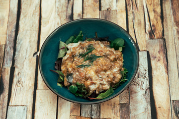 Moussaka, Oriental dish common to Turkey, Greece and the Balkans, consisting of aubergines baked.
