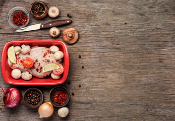 Raw chicken in baking dish