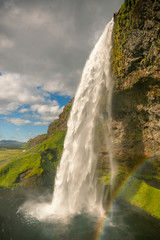 Fototapeta na wymiar Seljalandsfoss waterfall with rainbow, Iceland