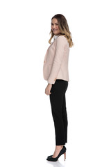 happy businesswoman in pink suit waiting in line