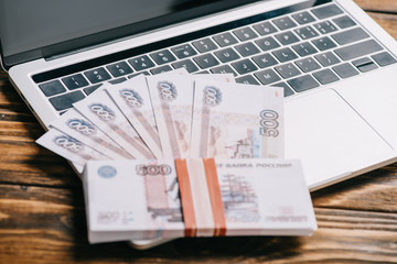 close-up view of russian rubles banknotes on laptop computer keyboard