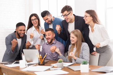 Success and team work. Business partners celebrating breakthrough