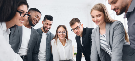 Business team looking at documents with results of work