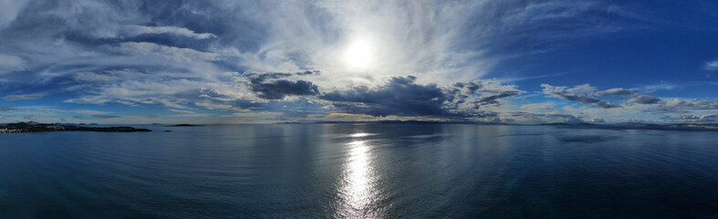 Aerial drone photo of beautiful sunset with nice clouds and golden colours over the Ionian sea