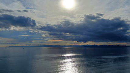 Aerial drone photo of beautiful sunset with nice clouds and golden colours over the Ionian sea