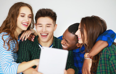 group of happy students people friends with phones tablets gadgets laugh.