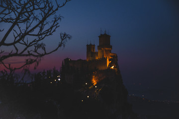 Obraz premium panoramic view of ancient medieval San Marino fortress on a winter sunset with few clouds