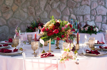 Fototapeta na wymiar table decorated with fresh flowers and candles for a wedding dinner