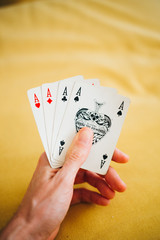 Close-up of hand holding playing cards