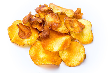 round appetizing fried potato chips on a white background