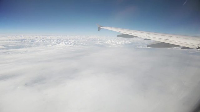 Footage of a passenger plane in flight, taken from inside the cabin.